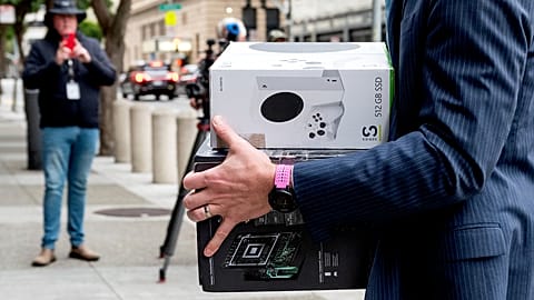 Xbox consoles are carried into a US federal courthouse in San Francisco as Microsoft defends its proposed takeover of Activision Blizzard. 28 June 2023.