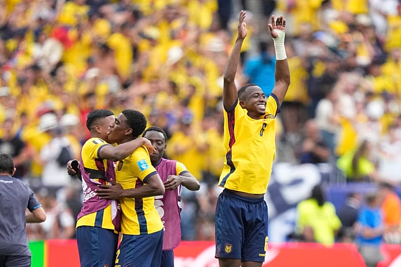 Ecuador players celebrate at the end of the World Cup Group E match against Germany in East Rutherford, NJ, near New York, Thursday, June 25, 2026