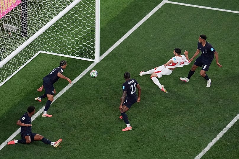 Turkey's Kaan Ayhan scores their third goal as US' Auston Trusty defends during the second half of a World Cup Group D match in Inglewood, California, Thursday, June 25, 2026