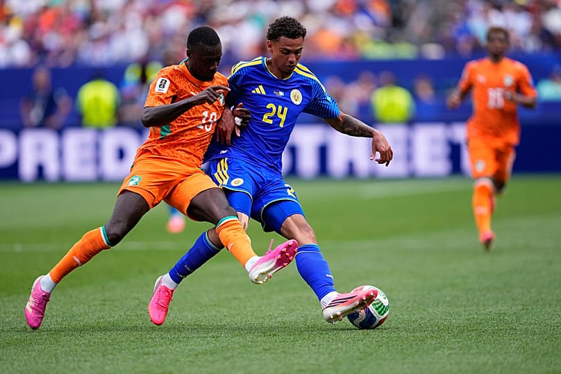 Ivory Coast's Nicolas Pepe and Curaçao's Deveron Fonville fight for the ball during the World Cup Group E match in Philadelphia, Thursday, June 25, 2026