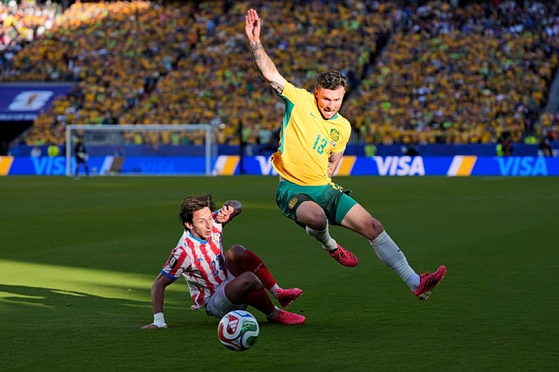 Australia's Aiden O'Neill battles for the ball with Paraguay's Matias Galarza during the World Cup Group D match in Santa Clara, California, Thursday, June 25, 2026