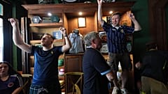 Scotland soccer fans with the Tartan Army play bagpipes, chant and dance in the Ball and Chain music bar 