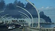 FILE: A plume of black smoke is seen over the port of St. Petersburg, Russia, June 3, 2026, after a Ukrainian drone attack.