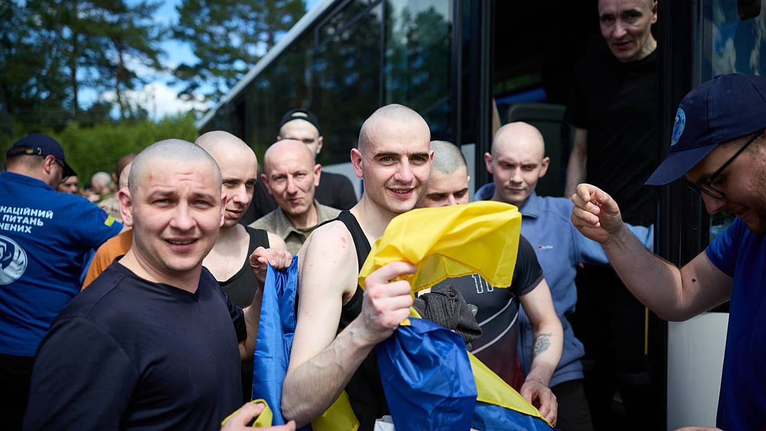 Ukrainian prisoners of war react after a prisoner exchange at an undisclosed location, Ukraine, Friday, June 26, 2026.