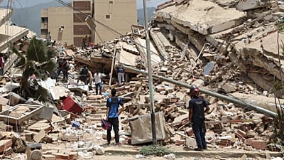 Residents search through the rubble of homes damaged in the earthquake and aftershocks that struck La Guaira, Venezuela, on 25 June 2026.