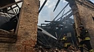 Rescue workers put out a fire at a building destroyed after a Russian strike on Zaporizhzhia, Ukraine, on Friday, June 26, 2026.