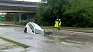 Police officer rescues woman whose vehicle fell into sinkhole in Virginia