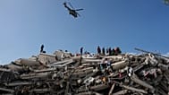 Rescue workers search through the rubble three days after earthquakes struck Catia La Mar, Venezuela, Saturday, June 27, 2026. (AP Photo/Fernando Vergara)
