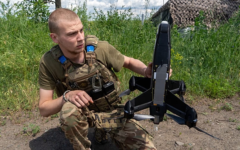 A Ukrainian serviceman of Khartia brigade launches an interceptor drone in Kharkiv region, 26 June, 2026