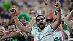An Algeria fan cheers before the World Cup Group J soccer match between Algeria and Austria in Kansas City