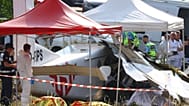 Forensic technicians examine a skydiving plane that crashed in Tomblaine northeastern France, killing all 11 people on board, Sunday, June 28, 2026. (AP Photo/Antonin Utz)