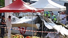 Forensic technicians examine a skydiving plane that crashed in Tomblaine northeastern France, killing all 11 people on board, Sunday, June 28, 2026. (AP Photo/Antonin Utz)