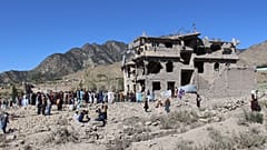Residents walk through the rubble after what Taliban officials said were Pakistani airstrikes in the village of Mandokhail, 29 June, 2026