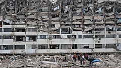 Rescue workers search through the rubble of a building that collapsed when earthquakes struck La Guaira, 28 June, 2026