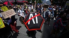 People participate in a march to protest the opening of AI data centers in Vancouver, British Columbia, 27 June 2026