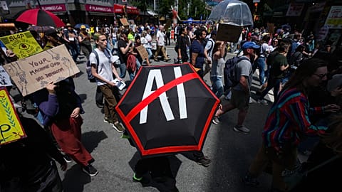 People participate in a march to protest the opening of AI data centers in Vancouver, British Columbia, 27 June 2026