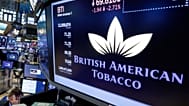 FILE. The logo for British American Tobacco appears above a trading post on the floor of the New York Stock Exchange, Jul. 2017