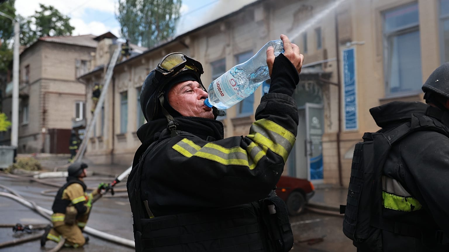 Rescue workers put out a fire at a building destroyed after a Russian strike on Zaporizhzhia, 26 June, 2026
