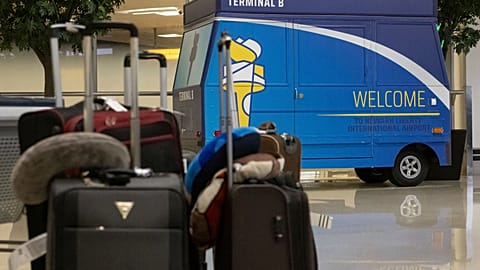 Suitcases are left on the floor at the international terminal at Newark Liberty International Airport,
