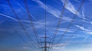 FILE - In this 1 Nov. 2017 file photo high power cables hang from a pole on a field in Hattersheim, Germany. 