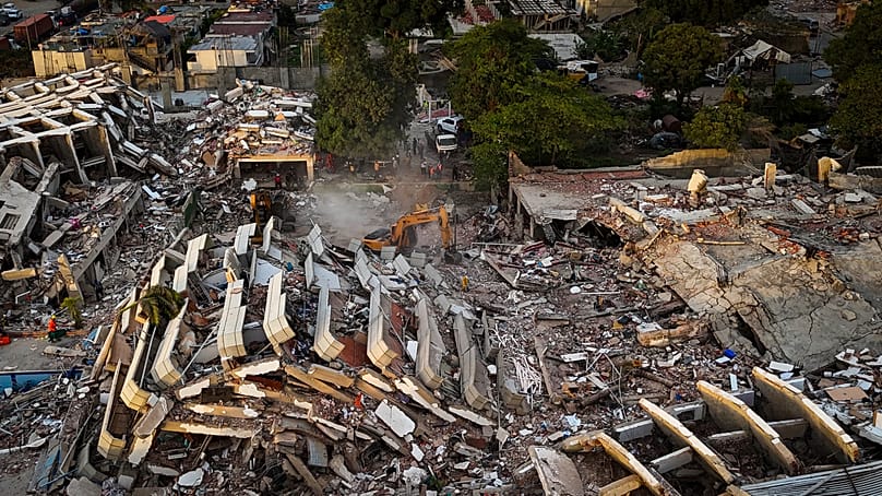 This aerial view shows destroyed buildings in Caraballeda, 29 June, 2026