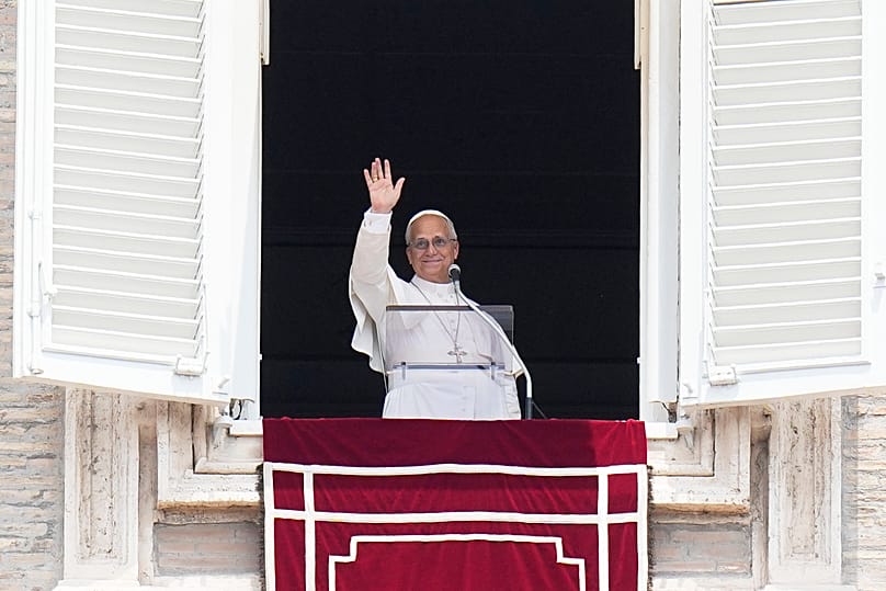 Pope Leo XIV waves during the Angelus noon prayer from the window of his studio overlooking St.Peter's Square at the Vatican, 29 June, 2026