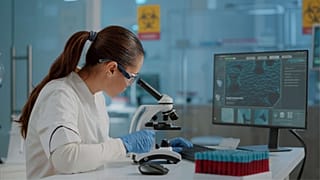 Illustration: Scientists conducting biomedical research in a laboratory.