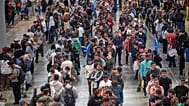 Migrants queue at a public service office to obtain paperwork needed to apply for Spain's immigration amnesty near Barcelona, 21 April, 2026