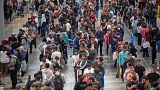 Migrants queue at a public service office to obtain paperwork needed to apply for Spain's immigration amnesty near Barcelona, 21 April, 2026
