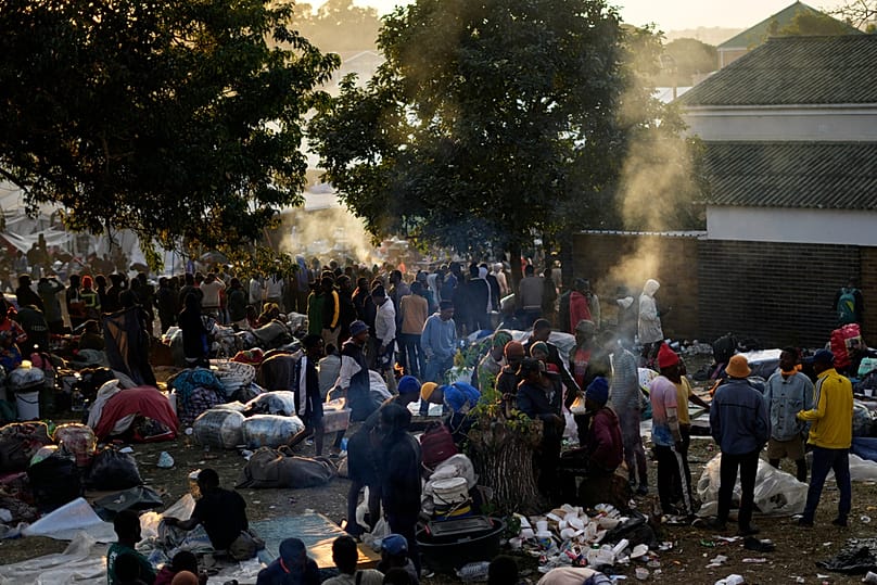 Malawian migrants stand in a queue ahead deportation, at a temporary centre in Durban, South Africa, Friday, June 19, 2026. 