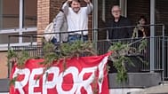 Investigative journalist Sigfrido Ranucci waves from a balcony at the RAI State TV headquarters, hours after an explosive device detonated under his car in Pomezia