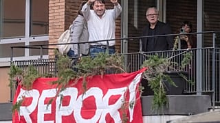 Investigative journalist Sigfrido Ranucci waves from a balcony at the RAI State TV headquarters, hours after an explosive device detonated under his car in Pomezia