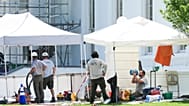 A National Park Service employee cools off while working near the North Portico of the White House, during a heatwave, Tuesday, June 30, 2026, in Washington.