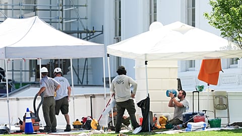 A National Park Service employee cools off while working near the North Portico of the White House, during a heatwave, Tuesday, June 30, 2026, in Washington.