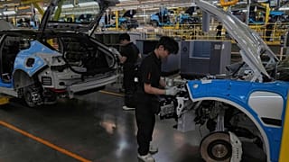 Workers assemble the Zeekr 001 EV models at the Chinese automaker Zeekr assembly plant in Ningbo, east China's Zhejiang Province, April 17, 2025