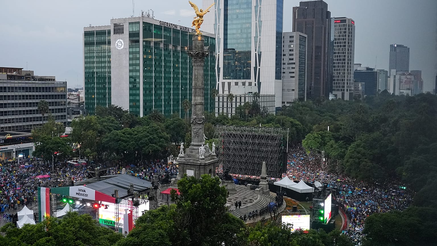 Soccer fans gather for a watch party for the World Cup soccer match between Mexico and Ecuador, at the base of the Angel of Independence monument in Mexico City, Tuesday.