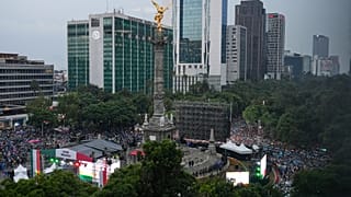 Soccer fans gather for a watch party for the World Cup soccer match between Mexico and Ecuador, at the base of the Angel of Independence monument in Mexico City, Tuesday.