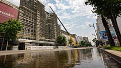 A portion of a main boulevard, with one lane flooded is blocked for traffic by police due to risk of roof collapses, in Bucharest, Romania, Wednesday July 1, 2026.