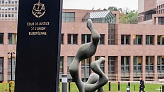 A man walks by the European Court of Justice in Luxembourg, Oct. 5, 2015.