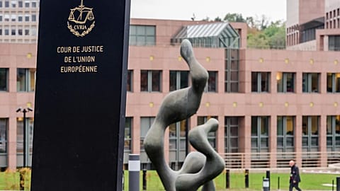 A man walks by the European Court of Justice in Luxembourg, Oct. 5, 2015.