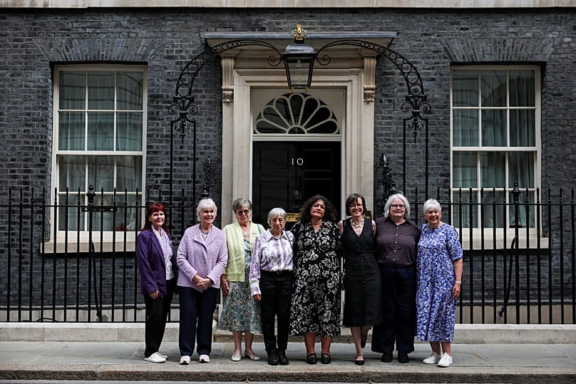 Campaigners pose for a photo after a meeting with British Prime Minister Keir Starmer to discuss historical forced adoption, outside 10 Downing Street in London, July 2, 2026.