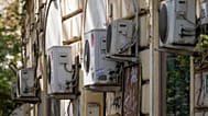 Air conditioning external units are seen on the wall of a building in Rome, Tuesday, July 25, 2023.