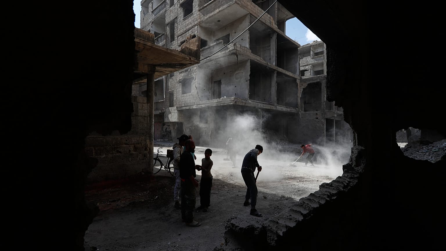 Residents remove rubble from damaged buildings in the al-Hajar al-Aswad neighbourhood on the outskirts of Damascus, 29 April, 2026
