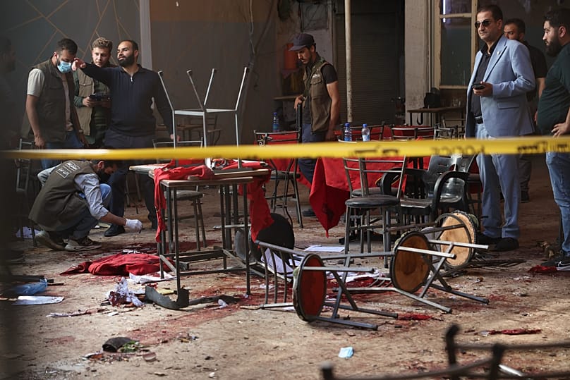 Syrian security inspects the site after an explosive device was detonated in a cafe near the main courthouse complex in Damascus, 2 July, 2026
