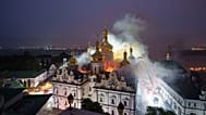 Rescue workers try to put out a fire at the Dormition Cathedral of thousand-year-old Monastery of Caves, also known as Kyiv Pechersk Lavra, following a Russian strike on Kyiv,