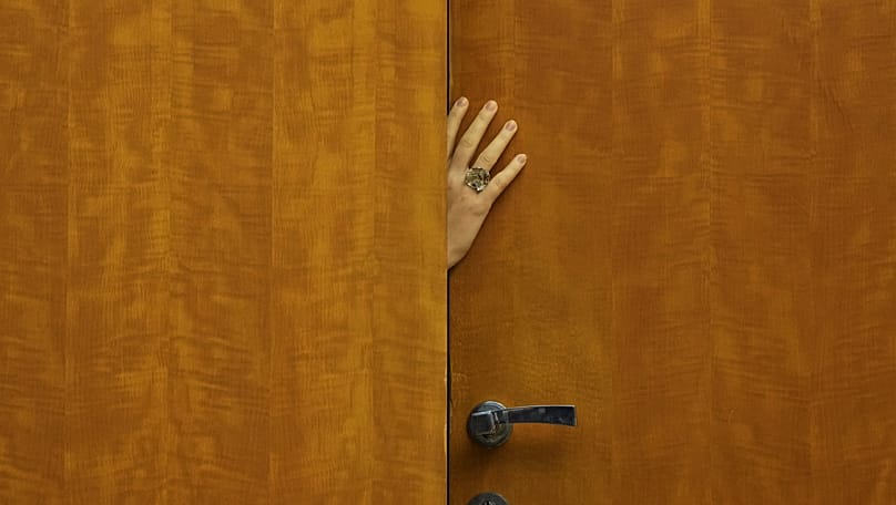 A staff member opens the door prior talks of European Commission President Ursula von der Leyen and Serbian President Aleksandar Vucic in Belgrade, Serbia, 15 October, 2025.