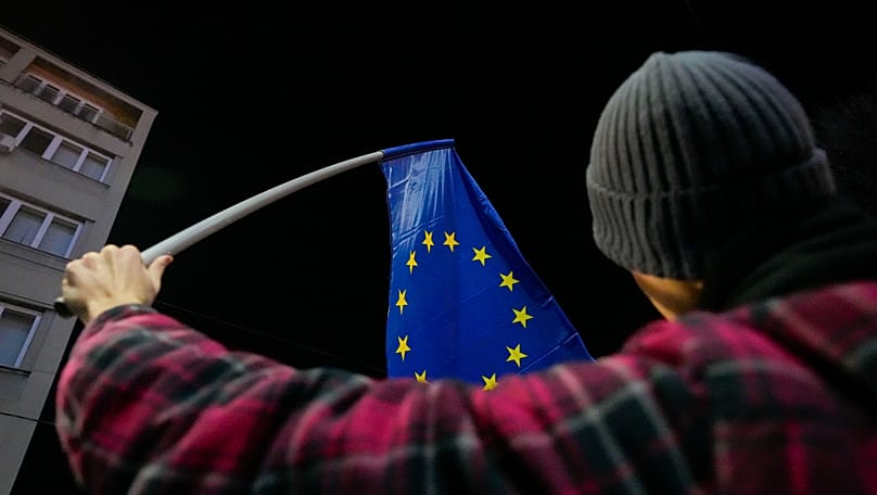 A protester waving an EU flag in Belgrade, Serbia, 16 January, 2024. 