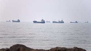 Commercial vessels are seen in the Strait of Hormuz off Bandar Abbas, 30 June 2026