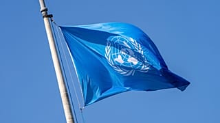 The UN flag waves the International Court of Justice in The Hague, 23 May, 2024