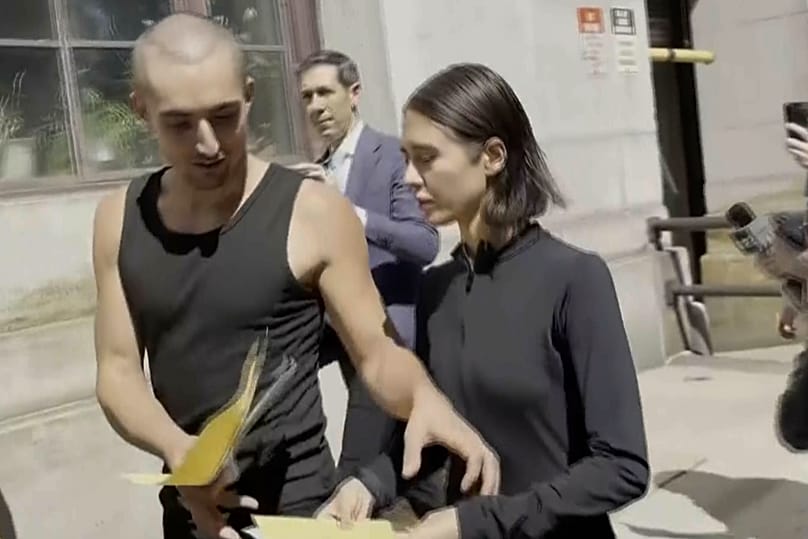 Angelina Nikolau and Ivan Kuznetsov depart a New York criminal courthouse building, 2 July, 2026